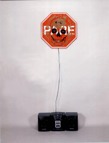 Singing stop sign by 
																	Tony Oursler