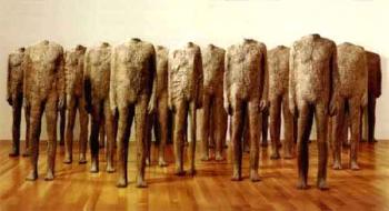 Crowd of standing figures by 
																	Magdalena Abakanowicz