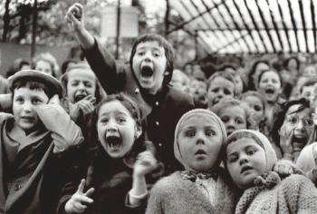 Children at a puppet theatre by 
																	Alfred Eisenstaedt