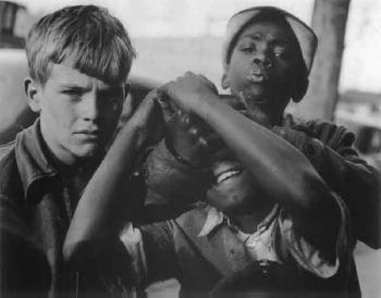 West Side - dockside, white and 2 black boys by 
																	Clemens Kalischer