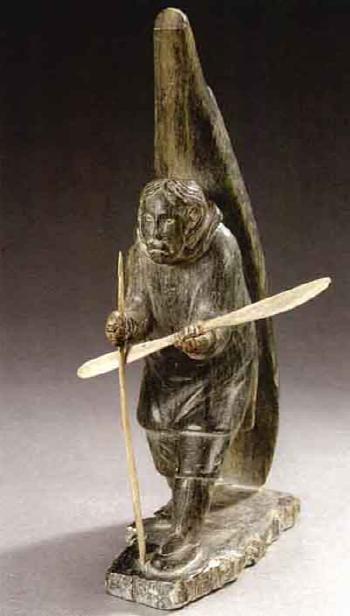 Eskimo with canoe and paddle by 
																	George Aggiaq