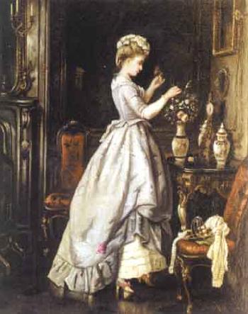 Young woman arranging flowers in an interior by 
																	 Lumley