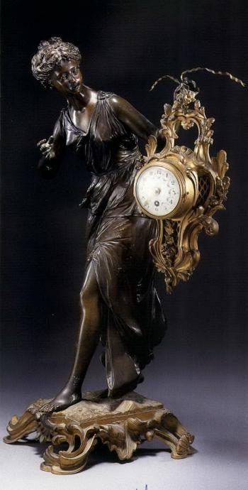 Partially clad maiden supporting mantel clock by 
																	 Raingo Brothers