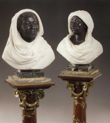 Male and female busts of Moors - Plinths by Henry Dasson by 
																	C Caccia