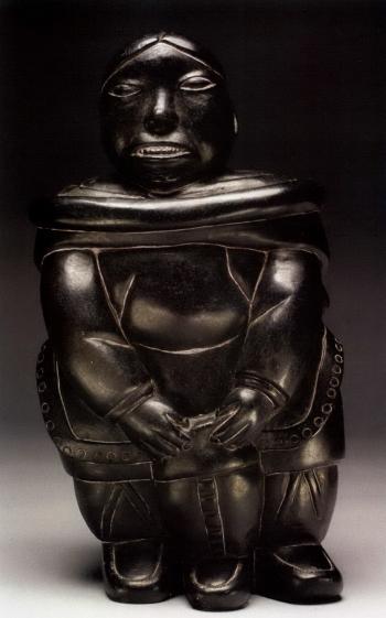 Woman holding a kamik by 
																	Abraham Nastapoka