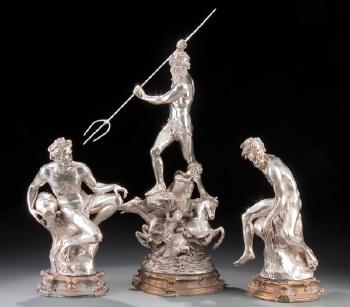 A three-piece figural grouping of Neptune and two attendants by 
																	Eugenio Avolio