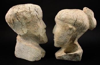 Heads of a man and a woman by 
																			Pauloosie Kakee