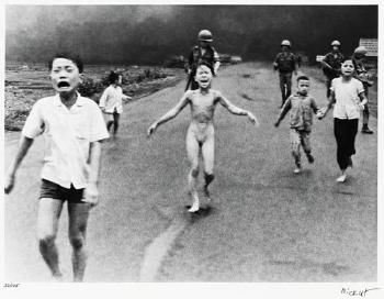 Children fleeing a napalm bomb attack, Trang Bàng, South Vietnam by 
																	Nick Ut