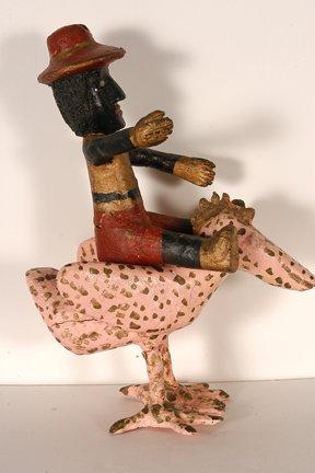 Black man riding a chicken by 
																			John Vivolo