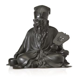Seated scholar holding a fan as he warms himself by a brazier by 
																	 Yoshimine