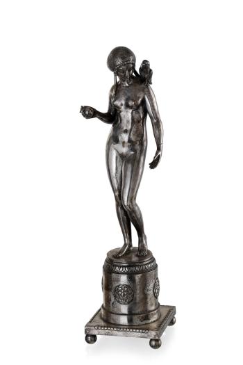 A German silvered bronze figure of a Girl with an apple and a parrot by 
																	Ignatius Taschner