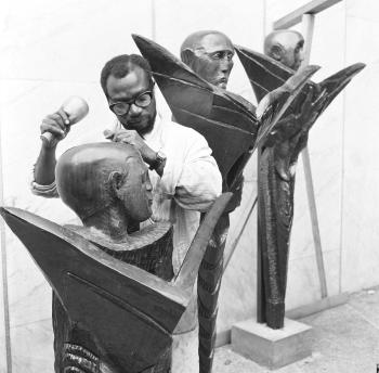 Seven wooden sculptures commissioned by the Daily Mirror in 1960 by 
																			Ben Enwonwu
