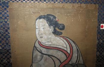 Standing woman in a floral rondel-patterned kimono by 
																			 Kaigetsu
