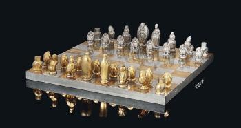 A Swedish Pewter And Gilt Pewter Chess Set And Board by 
																	Marie-Louise Idestam-Blomberg