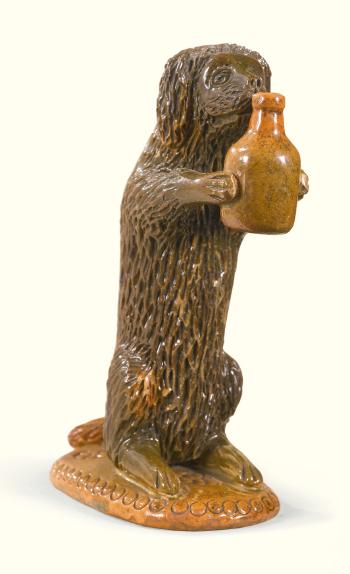 Upright Dog Holding a Jug by 
																	 S Bell and Sons