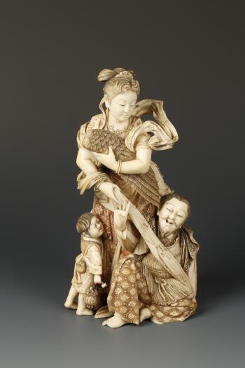 Maiden holding a wing and wearing flowing gowns, with a man and boy below by 
																	Suzuki Nobuyoshi