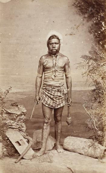 Australian chief. Australian man. Warrior. Man and woman in bush by 
																			John William Lindt