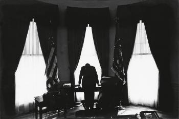 John F Kennedy in the oval office by 
																	George Tames
