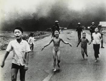 Children fleeing a napalm strike, South Vietnam by 
																	Nick Ut