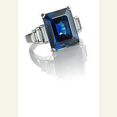 A sapphire and diamond ring set by 
																			 Magnus Enna