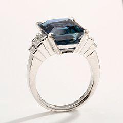 A sapphire and diamond ring set by 
																			 Magnus Enna