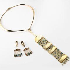 A jewellery set comprising a necklace and a pair of ear clips by 
																			 Hans Hansen Silver
