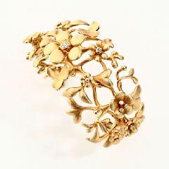 A diamond bangle, Flower set by 
																			Ole Lynggaard