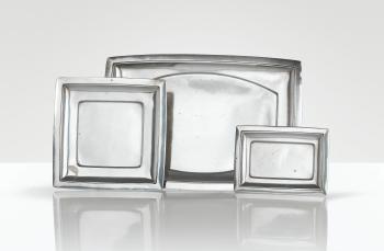 A Set Of Three Silver Serving Plates In Sizes by 
																	 Ravinet d'Enfert