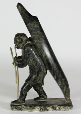 Hunter carrying a Kayak by 
																			George Aggiaq
