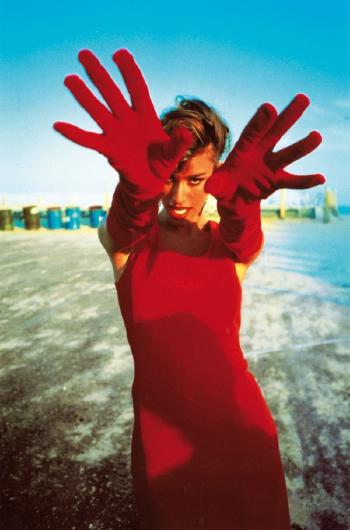 Susan Holmes with red gloves by 
																	Arthur Elgort