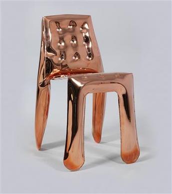A “Chippensteel Chair Copper” by 
																	Oskar Zieta