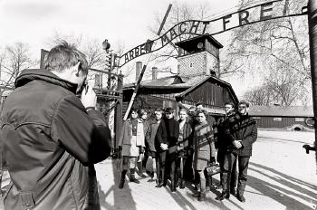 Visitor group at Auschwitz by 
																	Michael Ruetz
