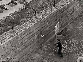 Olaf Playing Football At The Berlin Wall by 
																			Gunter Zint