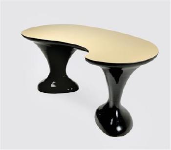 An oval table by 
																	 Atelier Raab
