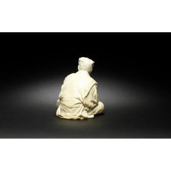 Okimono figure of a seated old man by 
																			 Ryuichi