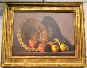 Still life of pomegranates, apples and a wicker basket on a ledge by 
																			Charles W Yeiser