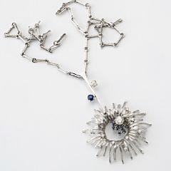 A sapphire and diamond necklace set by 
																			John Rorvig