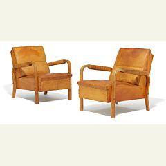 A pair of rare and early easy chairs by 
																			Alvar Aalto