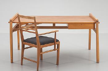A desk with chair by 
																			Marianne von Munchow