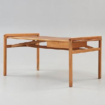 A desk with chair by 
																			Marianne von Munchow