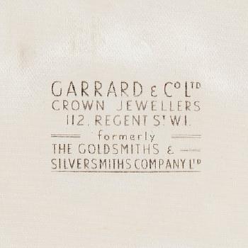 A diamond and sapphire set by 
																			 Garrard & Co Ltd