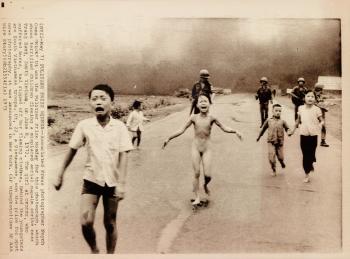 Terrified children fleeing a napalm strike near Trang Bang, South Vietnam by 
																	Nick Ut