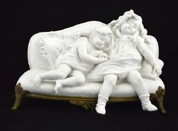 Two Children resting upon a sofa by 
																			Aristide Rousaud
