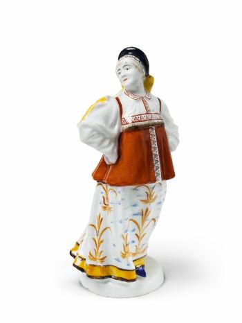 Figure of a dancing peasant woman in traditional costume. by 
																			Pawel Kamenskij