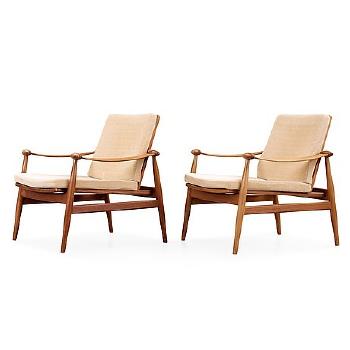 A Pair of Easy Chairs by 
																			Finn Juhl
