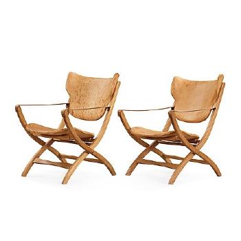 A Pair of Egyptian Folding Chairs by 
																			Poul Hundevad