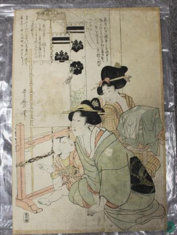 Two ladies and a child seated beside banners by 
																			 Utamaro