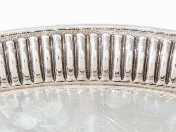 A large oval silver tray by 
																			 Edzard Gmbh & Co