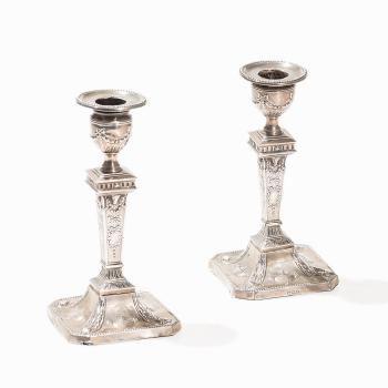 Pair of silver candlesticks by 
																			 Walter Latham & Son