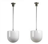 A pair of pendant lamps by 
																	 BAG Turgi